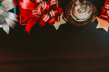 Christmas concept background with decorations and gift boxes and star on wooden boards with copy space, Image Style Vintage and Film Tone.の写真素材