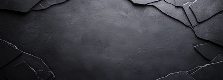 Monochrome abstract background with cracked dark slate texture. Ideal for designs needing a rugged, natural stone aesthetic.の素材