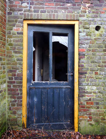 Old door in a ruin farmhouse