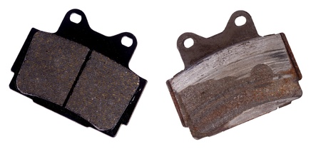 New and worn brake pad, isolated on backgroundの写真素材