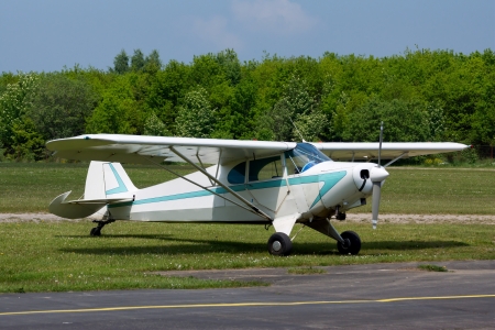 Small vintage airplane, parked at an airfieldの写真素材