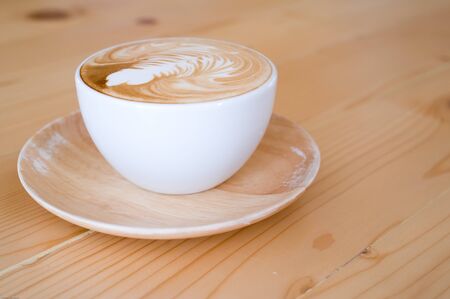 A cup of coffee on wooden tableの写真素材