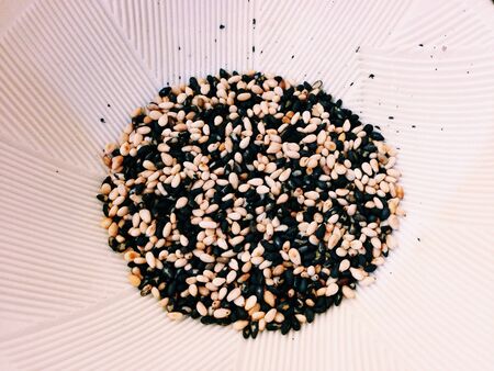 Sesame seeds in crush bowl.の素材