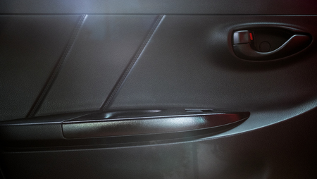 Car door panel in Toyota Yaris eco carsの写真素材