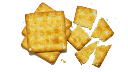 Group of crackers included pile of crackers and broken in pieces of themの写真素材