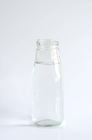 Water in a white glass bottle isolatedの写真素材