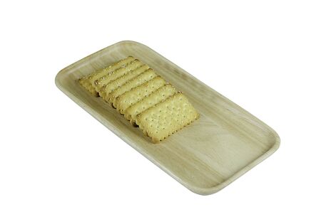 Baked bread in a wooden plate suitable for eating with coffee.