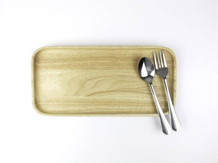 Cutlery, food, kitchenware in a wooden plateの写真素材