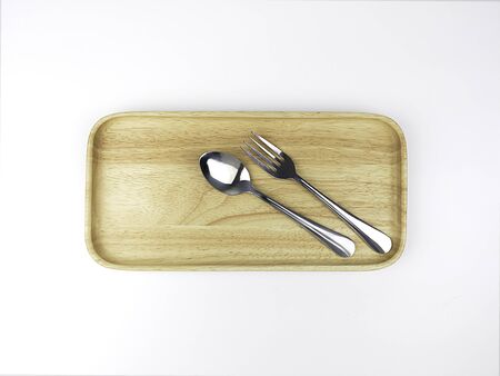 Cutlery, food, kitchenware in a wooden plateの写真素材
