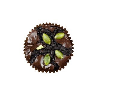 Chocolate muffins with almond nuts placed on a white background on the left, copying a separate area.の写真素材