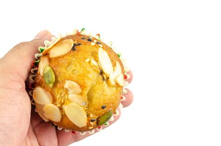 Delicious muffins in hand, isolated on whiteの写真素材
