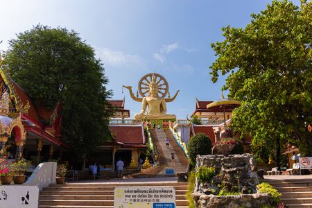SAMUI, THAILAND - JAN 9 : Scene in Wat Phra Yai (Big buddha temple) in Samui island with tourists...
