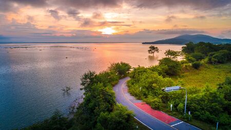 Aerial Photo Beautiful Road around the lakeの写真素材