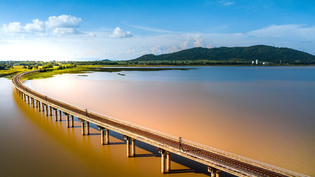 Aerial Photo Railway Curve Track to the mountains is located on the River Pasak River Dam,Lopburi Thailandの写真素材