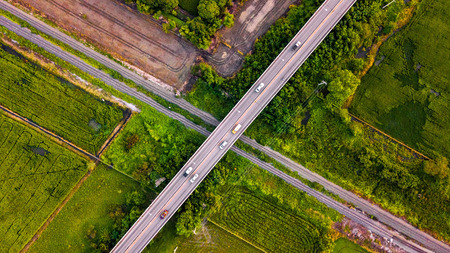 Aerial Photo Countryside Car Running on Road Bridge Over Railway Bypass route the City Drone Top Viewの写真素材