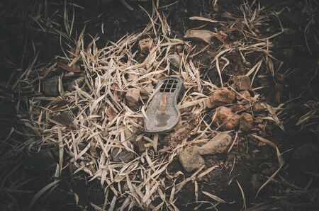 Close up shoe broken by his hiking bootsの写真素材