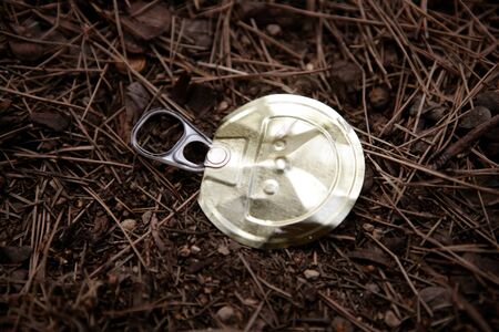 Top of a can over a forest floor. Enviromental issue