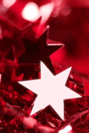 Christmas star card decoration still at studio red backgroundの写真素材