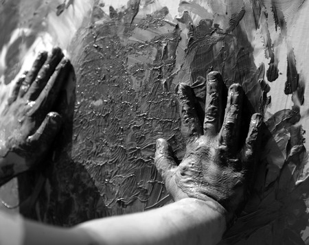 Children dirty dark hands, paint game, mud, grease, black and whiteの写真素材