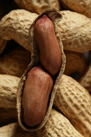 Peanuts macro over warm wood background