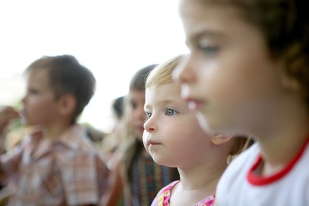 Spectator children observing spectacle. Looking at the showの写真素材