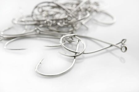 fishing hooks over white background, fisherman equipmentの写真素材
