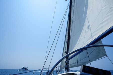 Sailing with an old sailboat over blue mediterranean summer sea