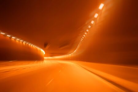 Red golden blurred light tunnel, alcoholic driverの写真素材