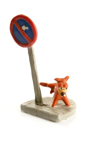 plasticine handmade dog, pee on signal pole isolated over whiteの写真素材