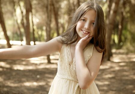 Portrait of beautiful teen girl outdoors in summertimeの写真素材