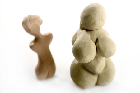 Fat woman handmade plasticine figurine isolated on whiteの写真素材
