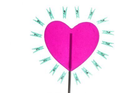 Conceptual housewife valentines heart metaphor with clothes pinの写真素材