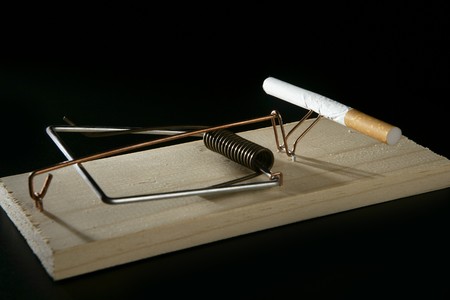 Smoking metaphor, cigarette addiction as a mouse trapの写真素材