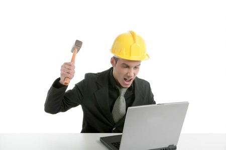 Amgry businessman, hammer against computer, yellow helmet
