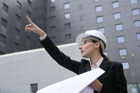 architect woman working outdoor with modern buildingsの写真素材