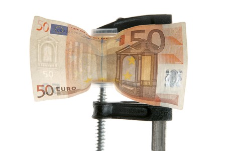 Euro bank note under pressure. Business crisis metaphorの写真素材