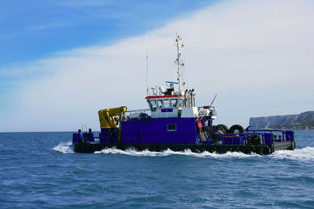 Dredge on the sea, big boat to drag marine bottom on harbor construction