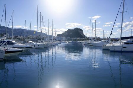 Beautiful marina view, sailboats and motorboats in blue waterの写真素材