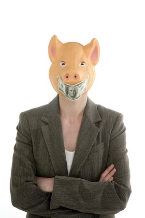 Funny businesswoman with swine face and dollar note maskの写真素材