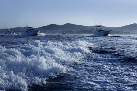 Fishing boat in a big game summer blue morning in Mediterranean seaの写真素材