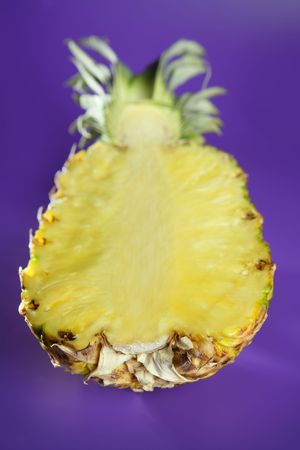 Pineapple with selective focus over purple backgroundの写真素材