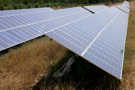 Solar cell panels in a row on Mediterranean electric plantの写真素材