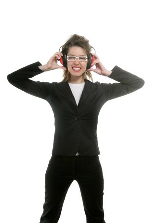Businesswoman with noise safety headphones and expressionの写真素材