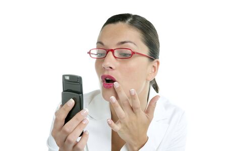 Businesswoman with red lipstick using mobile phone as a mirrorの写真素材