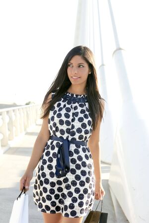 Beautiful brunette shopaholic outdoor modern city urban streetの写真素材