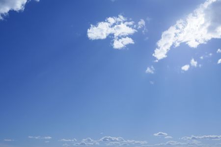 Blue sky background and summer white clouds の写真素材