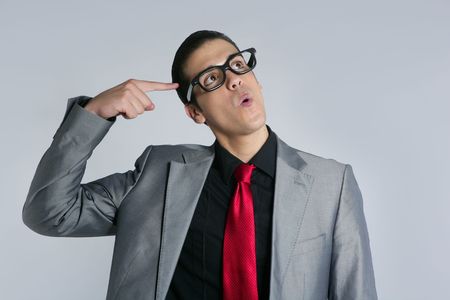 Businessman crazy with funny glasses and suit on gray backgroundの写真素材