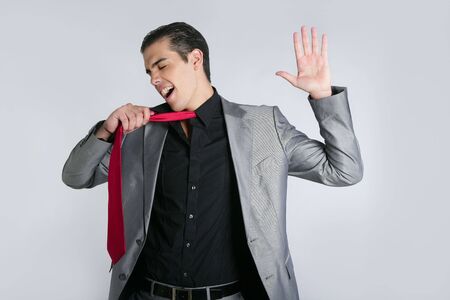 Businessman break finish work upset take off tieの写真素材