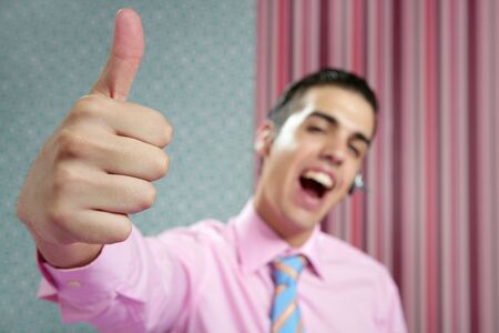 Businessman young with okay sign in his hand over wallpaper backgroundの写真素材