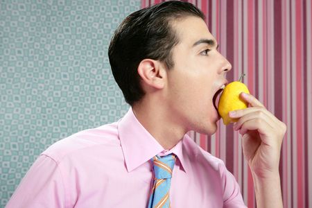 Funny businessman with lemon fruit on his hand in wallpaper backgroundの写真素材